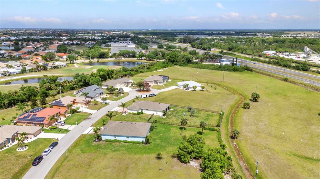 7028 North Plum Tree Punta Gorda, FL 33955 - Photo 52 of 57 an aerial view of residential houses with outdoor space