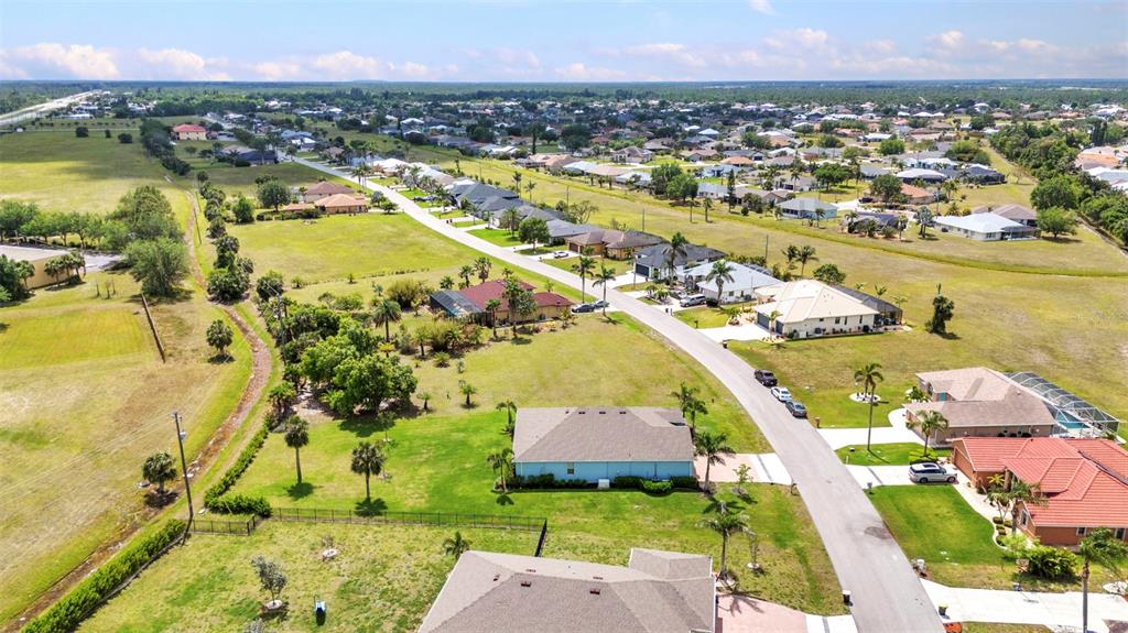 7028 North Plum Tree Punta Gorda, FL 33955 - Photo 55 of 57 an aerial view of residential houses with outdoor space