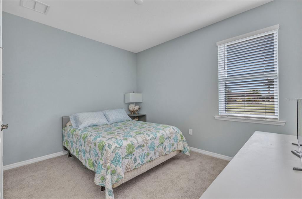 7028 North Plum Tree Punta Gorda, FL 33955 - Photo 8 of 57 a bedroom with a bed and window