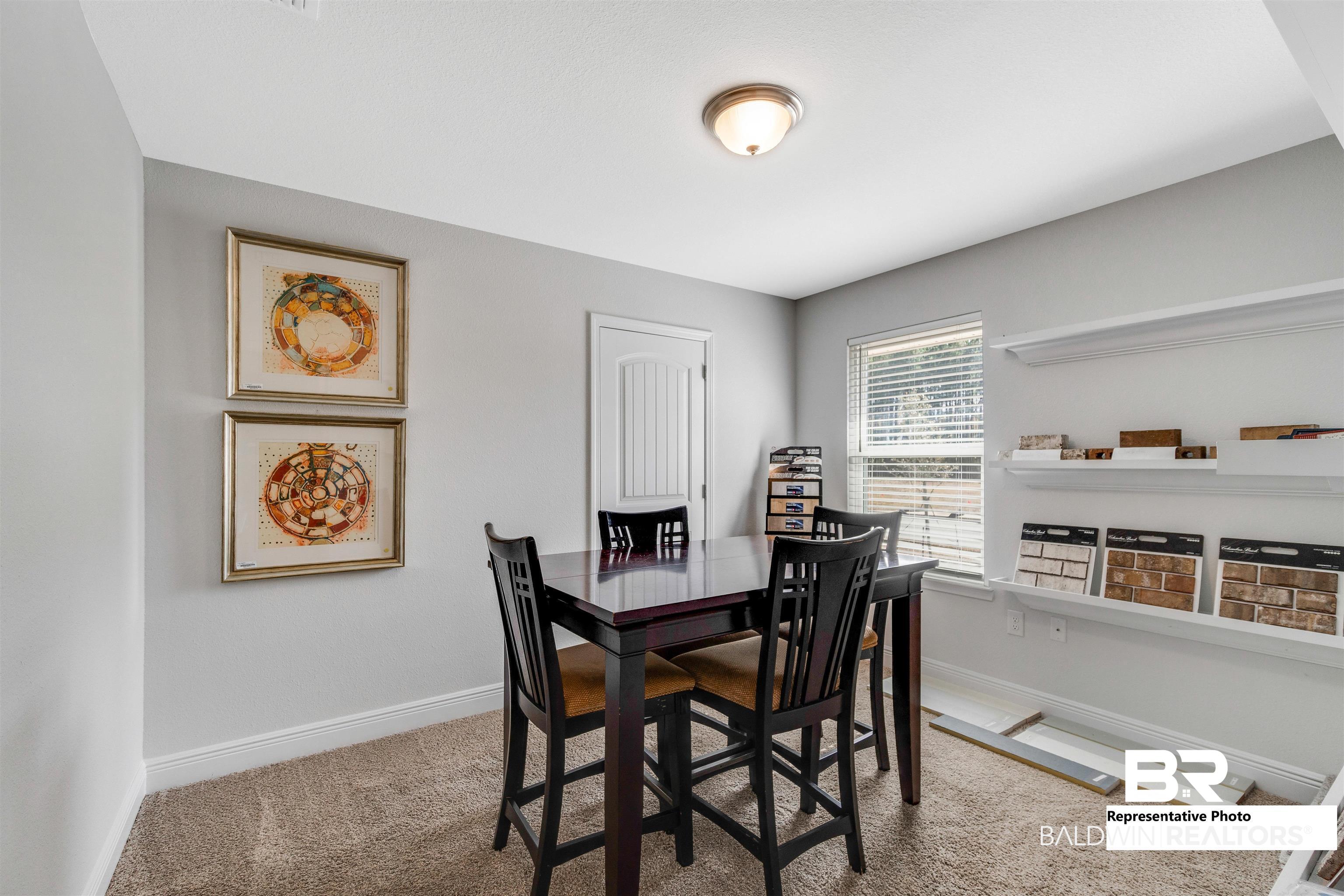 643 Mayflower Drive Foley, AL 36535 - Photo 5 of 34 Carpeted dining room featuring baseboards