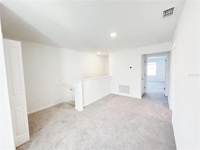 an empty room with a bathroom