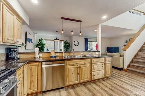 a kitchen with sink and cabinets