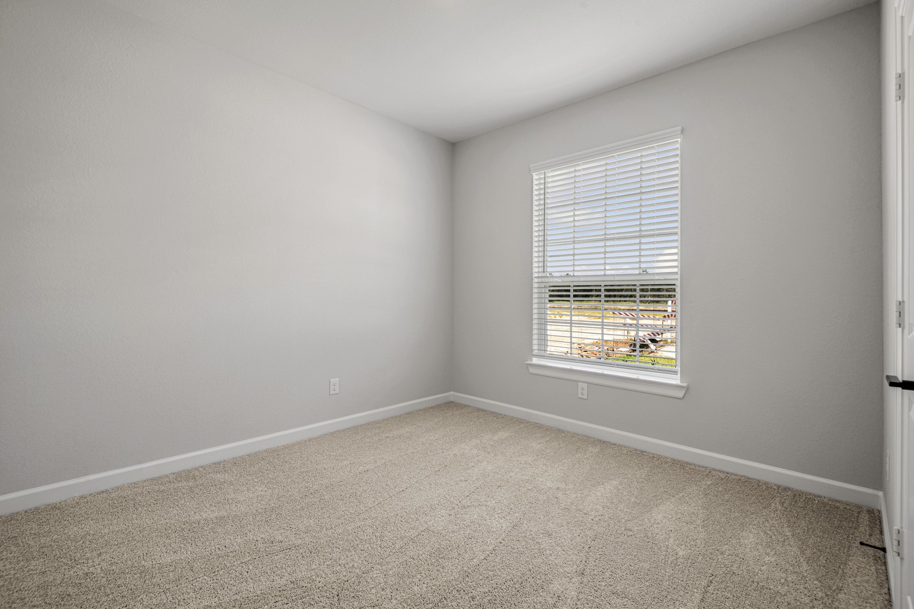 15683 Honey Cv Drive Conroe, TX 77303 - Photo 13 of 24 an empty room with a window