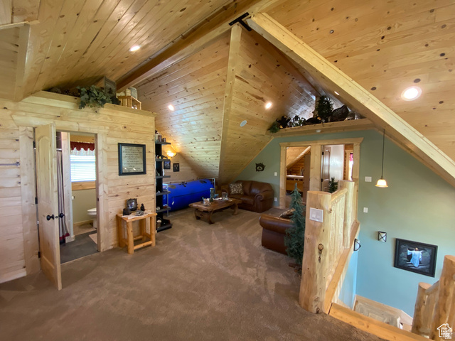 79 Auburn Forest Road Auburn, WY 83111 - Photo 39 of 76 Bonus room with a wood ceiling with exposed beams, carpet, and recessed lighting