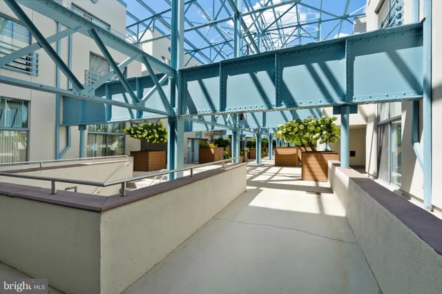 a swimming pool with outdoor seating and yard