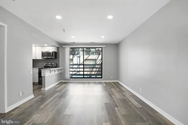 a view of kitchen with microwave and window