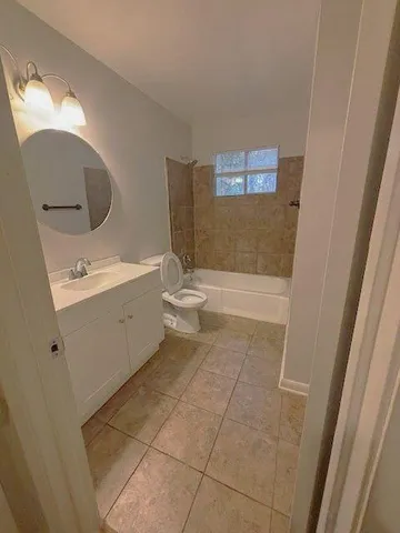 a bathroom with a bathtub sink and toilet