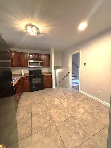 a view of a kitchen with a sink