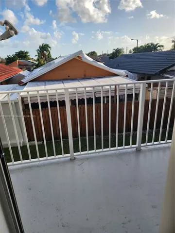 a view of outdoor space with wooden deck and furniture