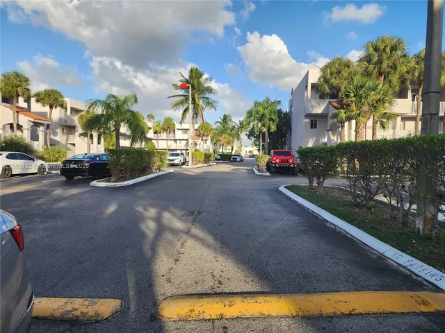 a view of a car parked in front of a house