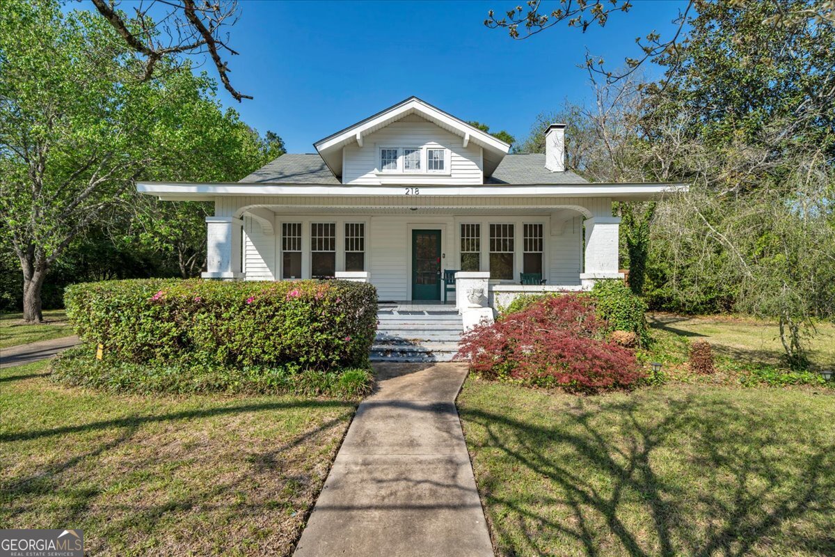 218 West Drive Dublin, GA 31021 - Photo 1 of 49 a front view of a house with garden