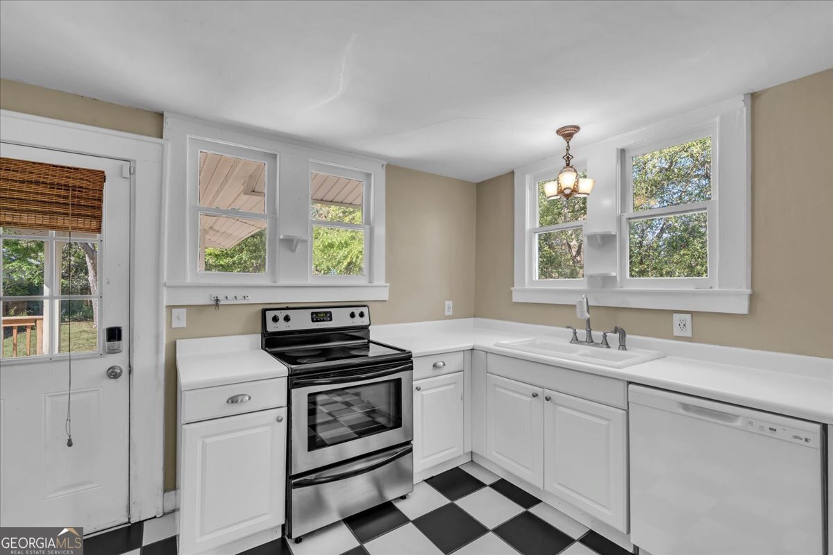218 West Drive Dublin, GA 31021 - Photo 15 of 49 a kitchen with appliances cabinets and a window