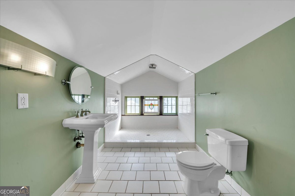 218 West Drive Dublin, GA 31021 - Photo 28 of 49 a bathroom with a sink toilet and a mirror