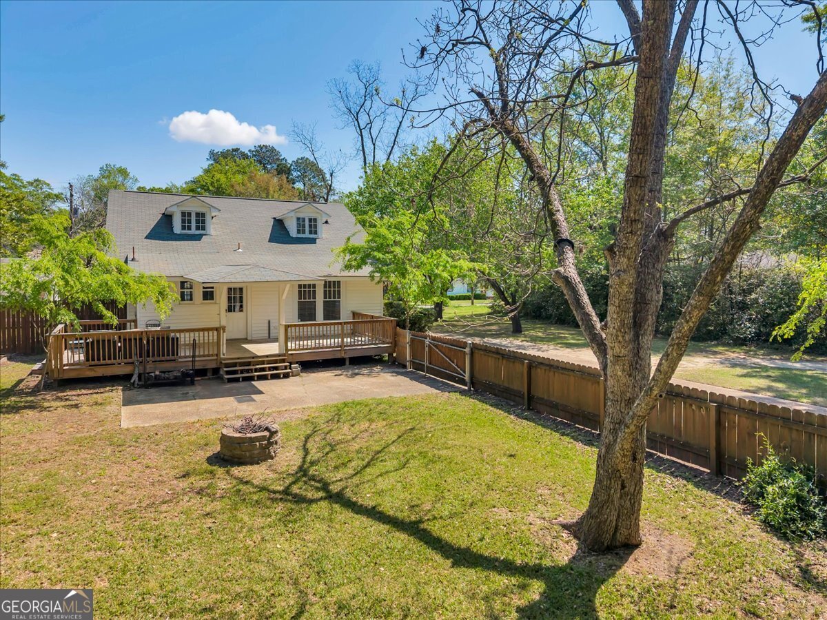 218 West Drive Dublin, GA 31021 - Photo 36 of 49 a swimming pool with outdoor seating and yard