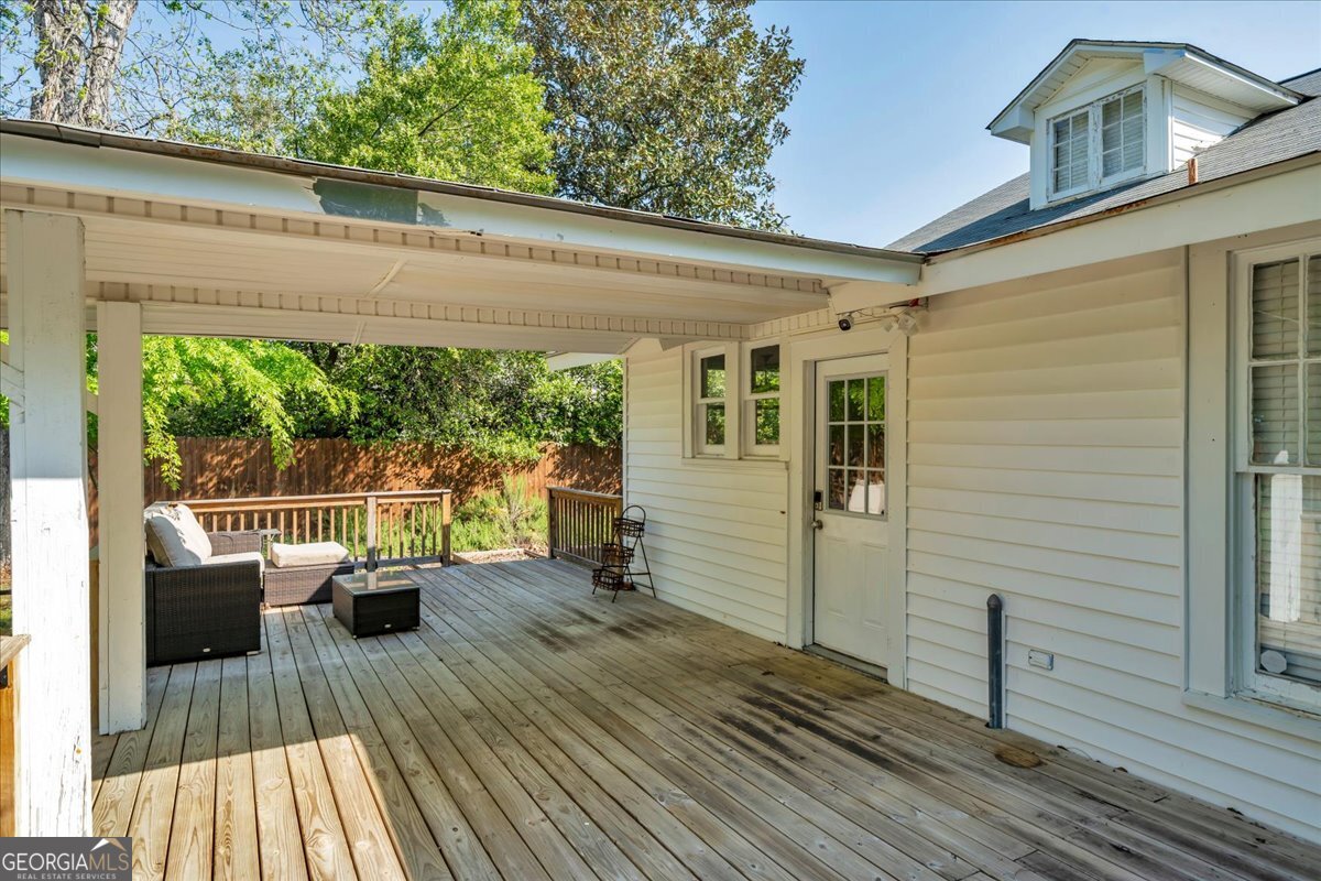 218 West Drive Dublin, GA 31021 - Photo 41 of 49 a view of balcony with couch and wooden floor