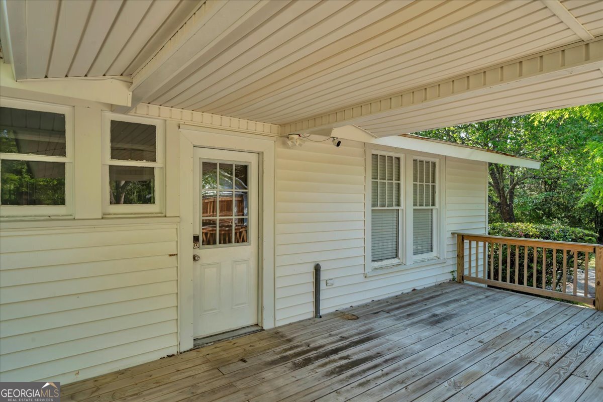 218 West Drive Dublin, GA 31021 - Photo 45 of 49 a view of front door and porch with wooden floor