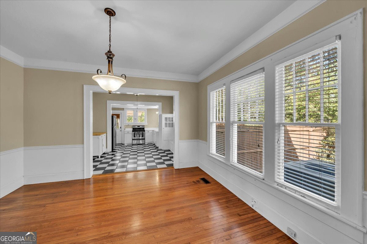 218 West Drive Dublin, GA 31021 - Photo 9 of 49 a view of an empty room with window and wooden floor