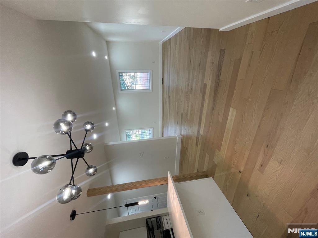 399 18th Avenue, Unit 1 Newark, NJ 07108 - Photo 5 of 9 a view of a hallway with a ceiling fan and window