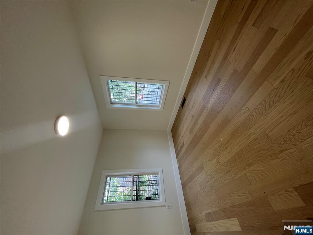 399 18th Avenue, Unit 1 Newark, NJ 07108 - Photo 7 of 9 an empty room with windows