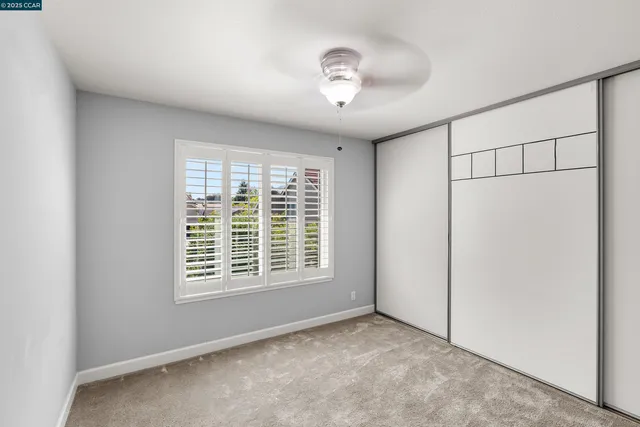 a view of a house with pool and sitting area