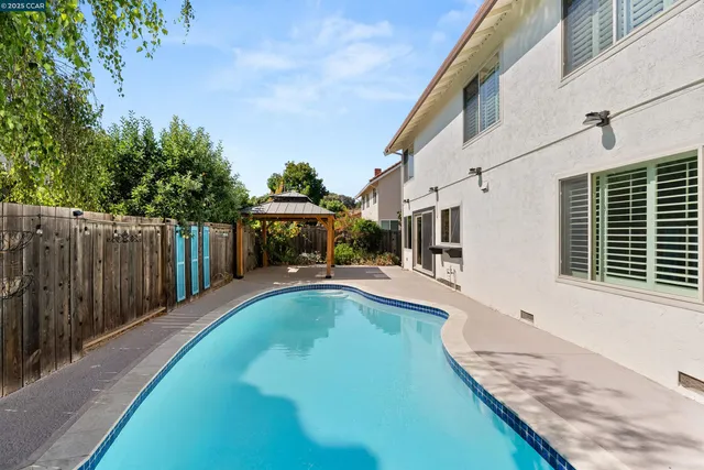 an aerial view of mountain with an ocean