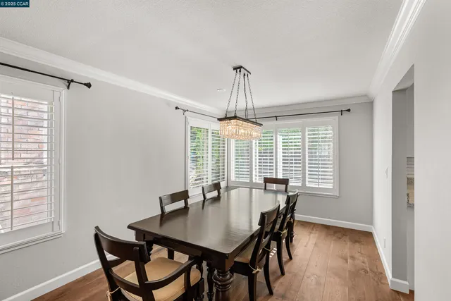 a view of dining room with furniture and a window