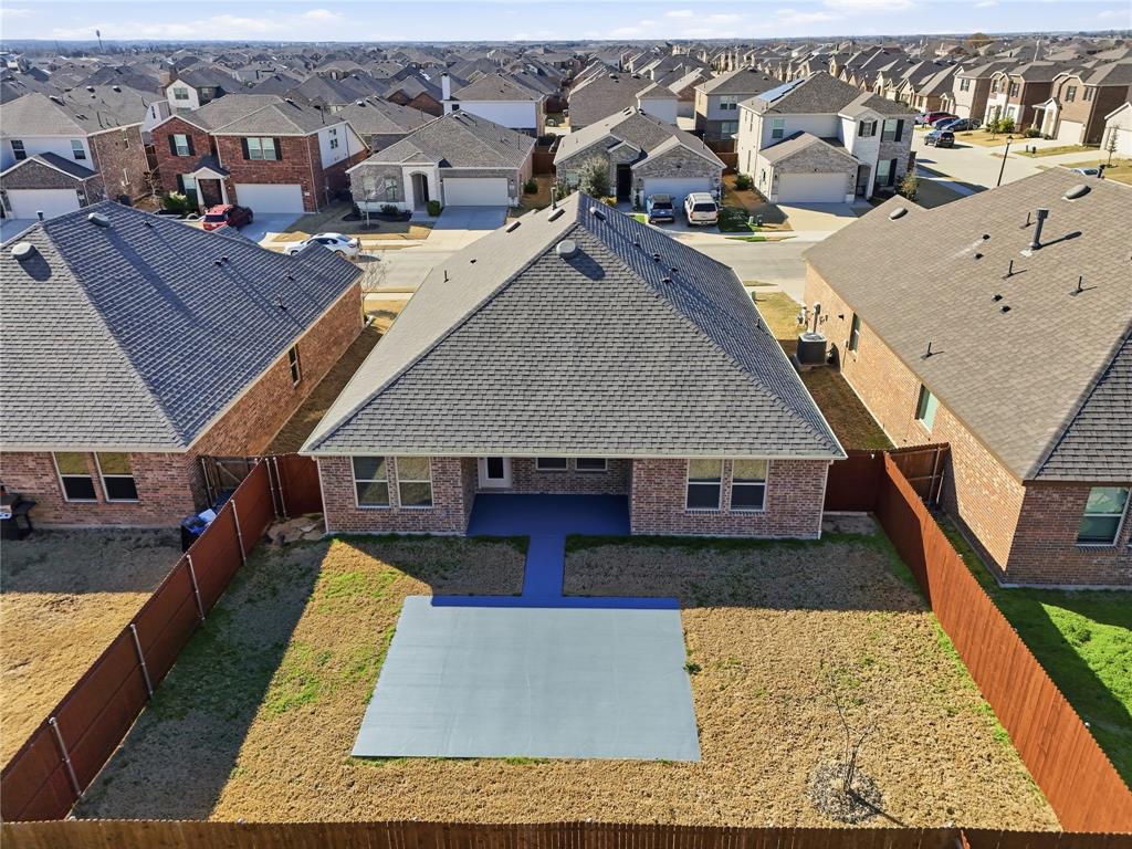 an aerial view of a house with roof deck