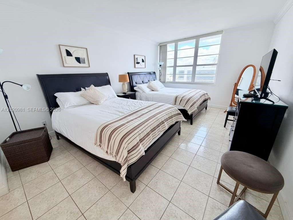 100 Lincoln Road, Unit 1423 Miami Beach, FL 33139 - Photo 10 of 17 a bedroom with a bed and a couch