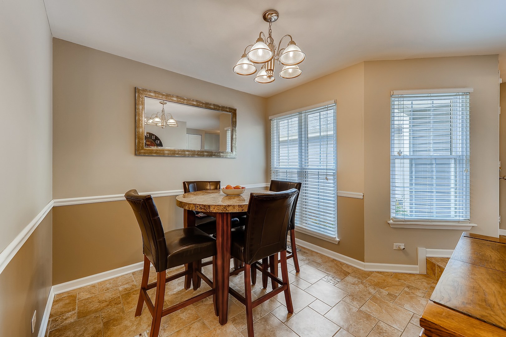 1043 Ridgefield Circle Carol Stream, IL 60188 - Photo 11 of 40 a view of a dining room with furniture and chandelier