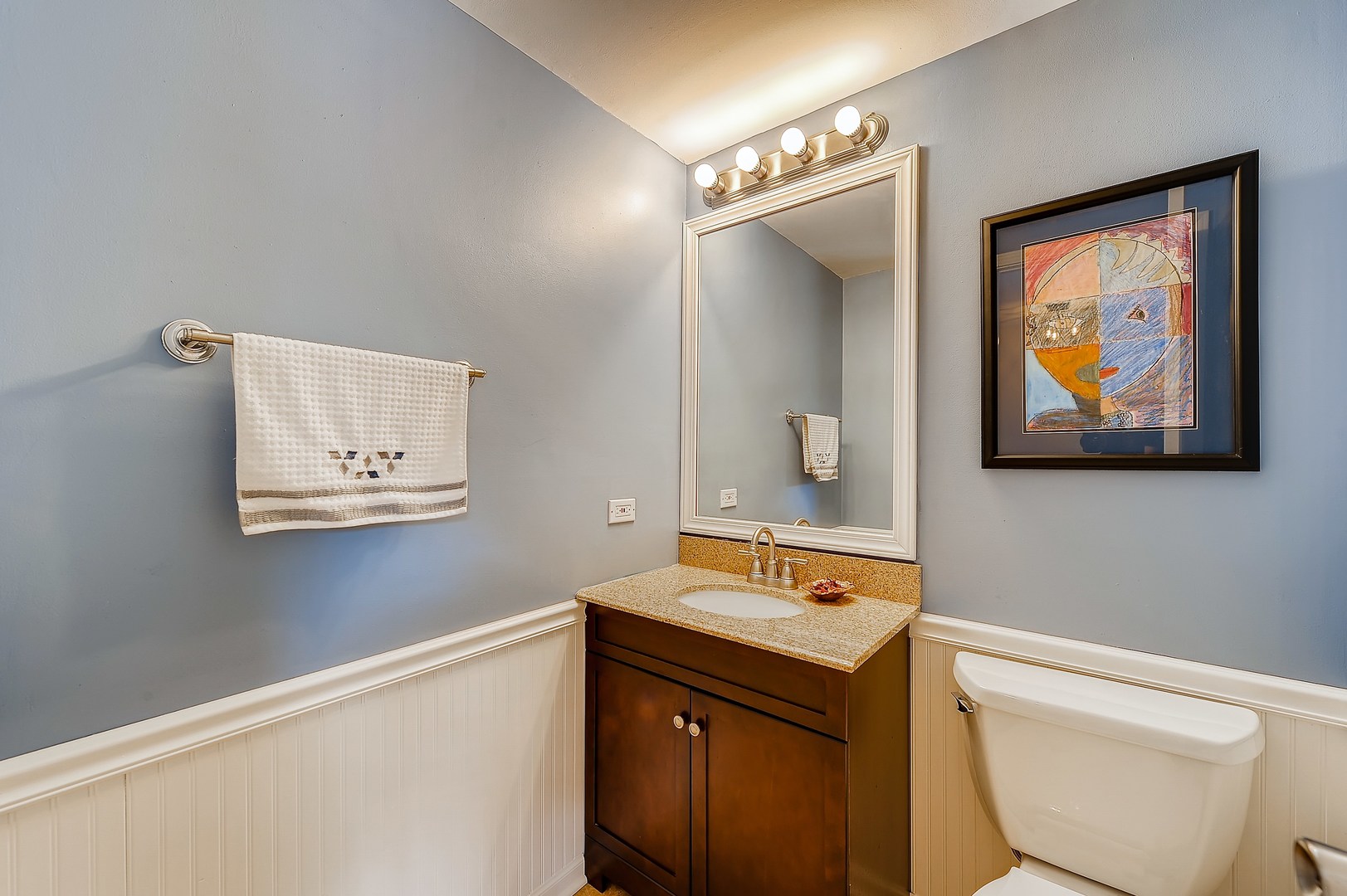 1043 Ridgefield Circle Carol Stream, IL 60188 - Photo 15 of 40 a bathroom with a toilet sink and mirror