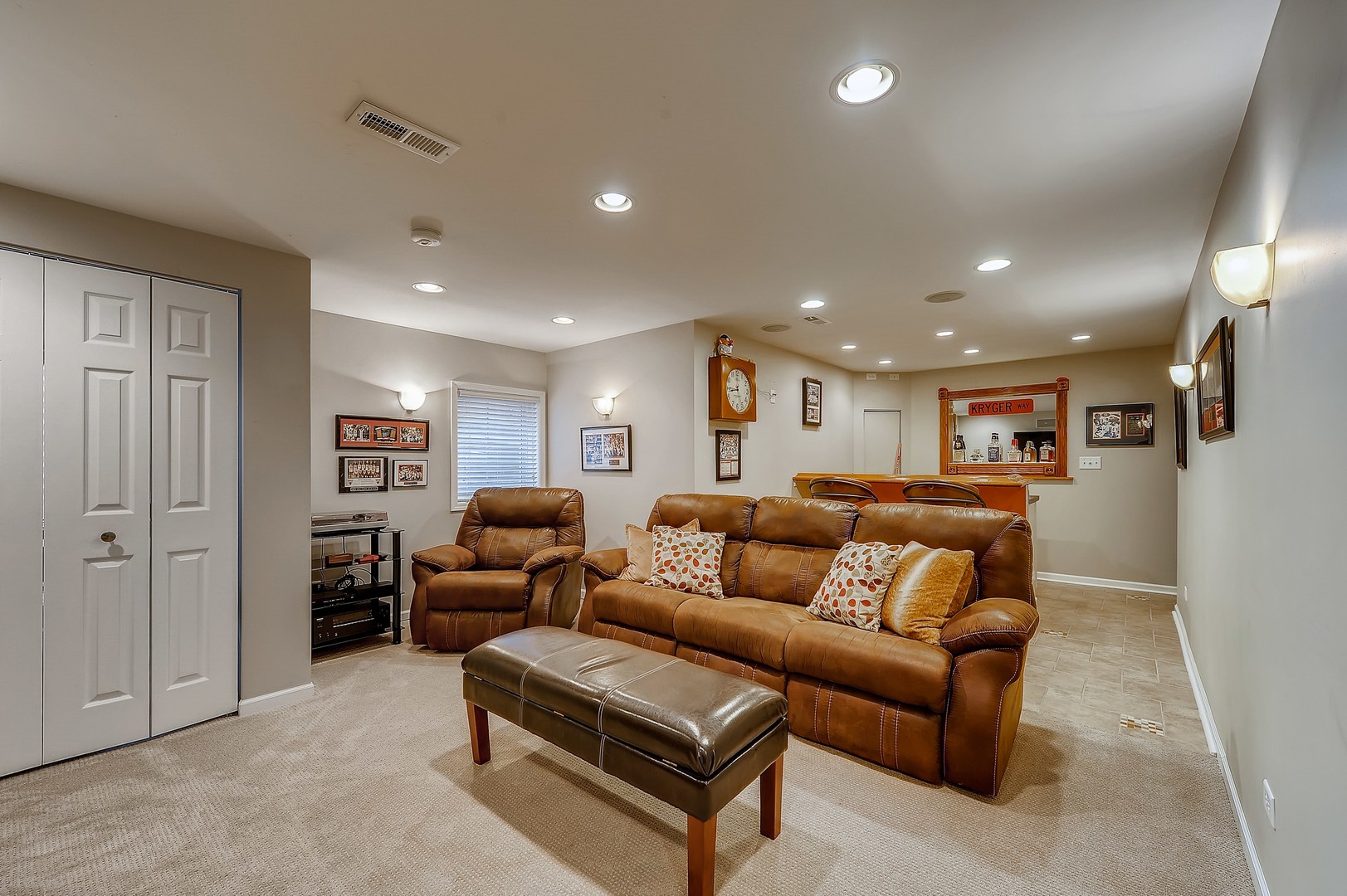 1043 Ridgefield Circle Carol Stream, IL 60188 - Photo 25 of 40 a living room with furniture and a glass door