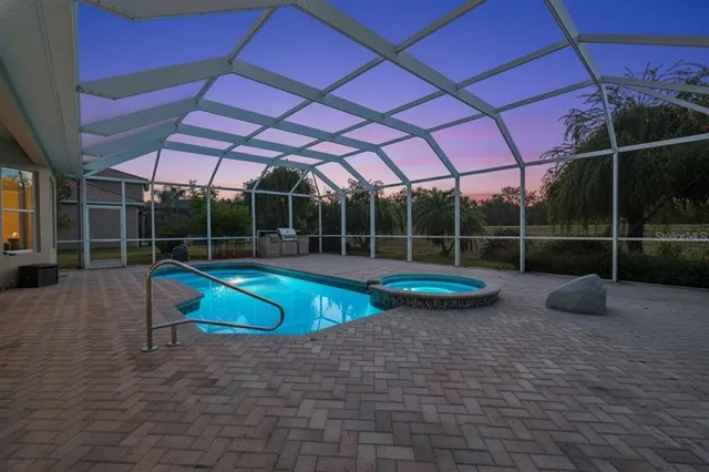 a view of a chairs and table in the patio