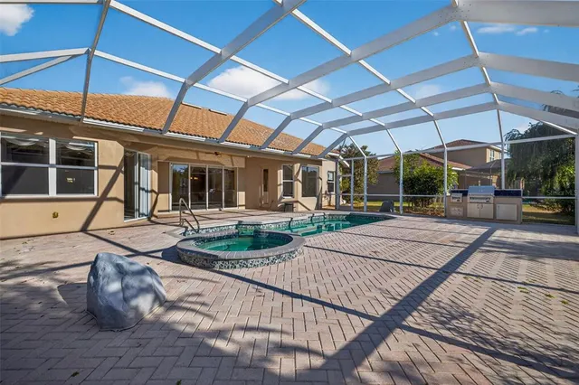 a view of a backyard with sitting area