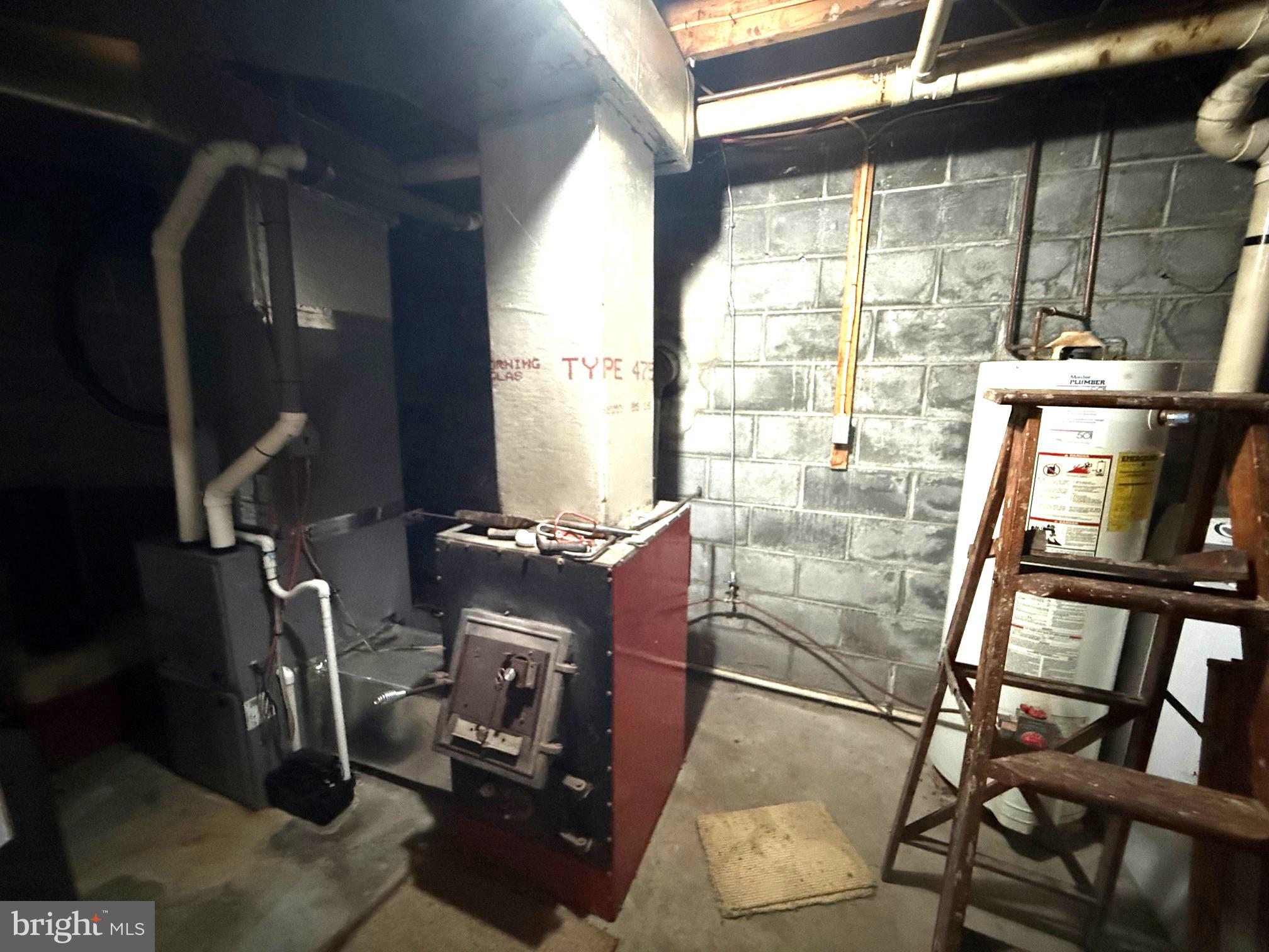 1492 Dice Warner Road Circleville, WV 26804 - Photo 27 of 36 Basement utility space with heating system.