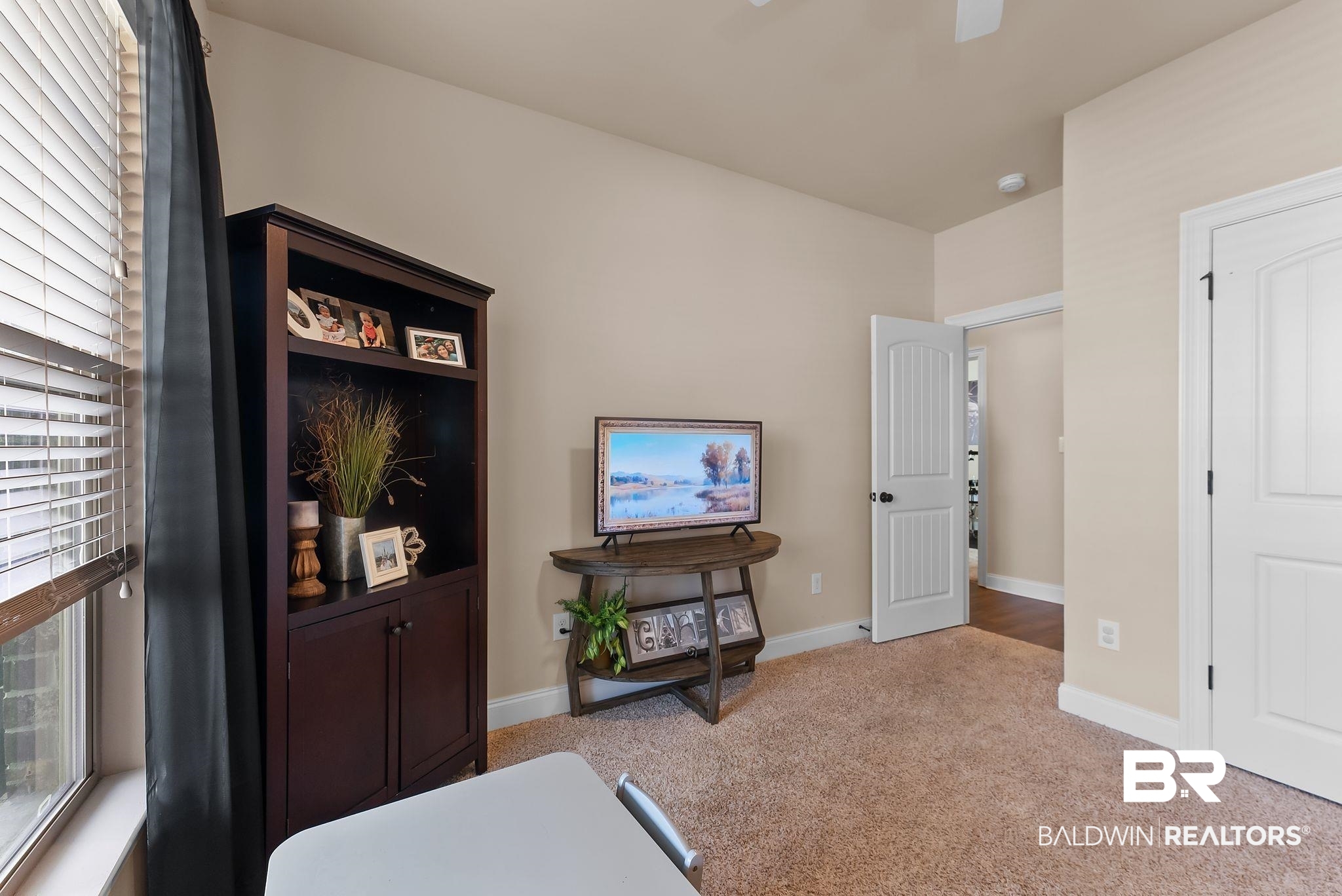 7015 Rocky Rd Loop Gulf Shores, AL 36542 - Photo 17 of 41 Living area featuring light colored carpet and ceiling fan