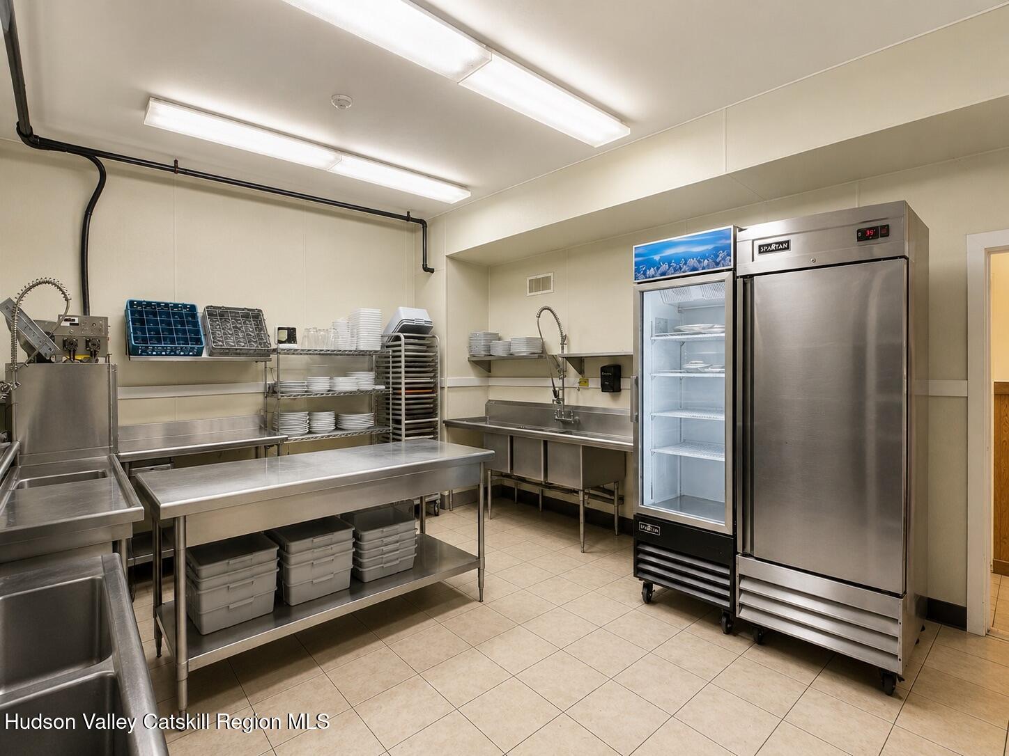 7 Main Street Catskill, NY 12414 - Photo 25 of 40 a kitchen with stainless steel appliances kitchen island granite countertop a refrigerator and a stove