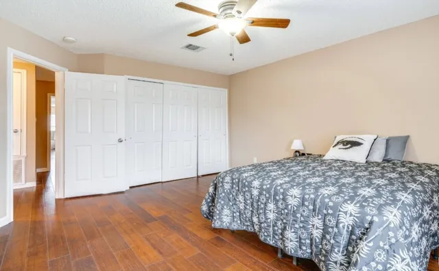 a bedroom with bed and window