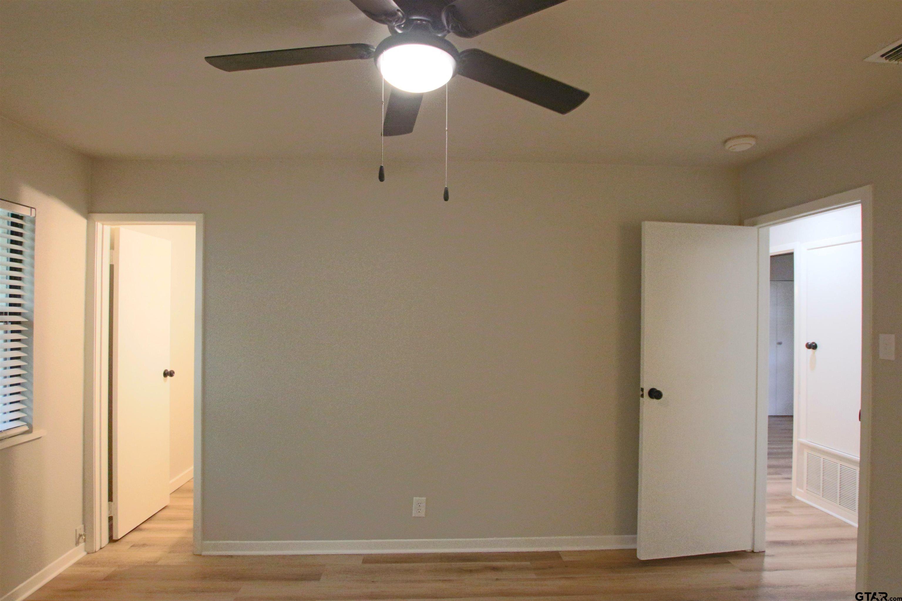 12336 Chapman Road Tyler, TX 75708 - Photo 13 of 19 a view of a hallway with wooden floor