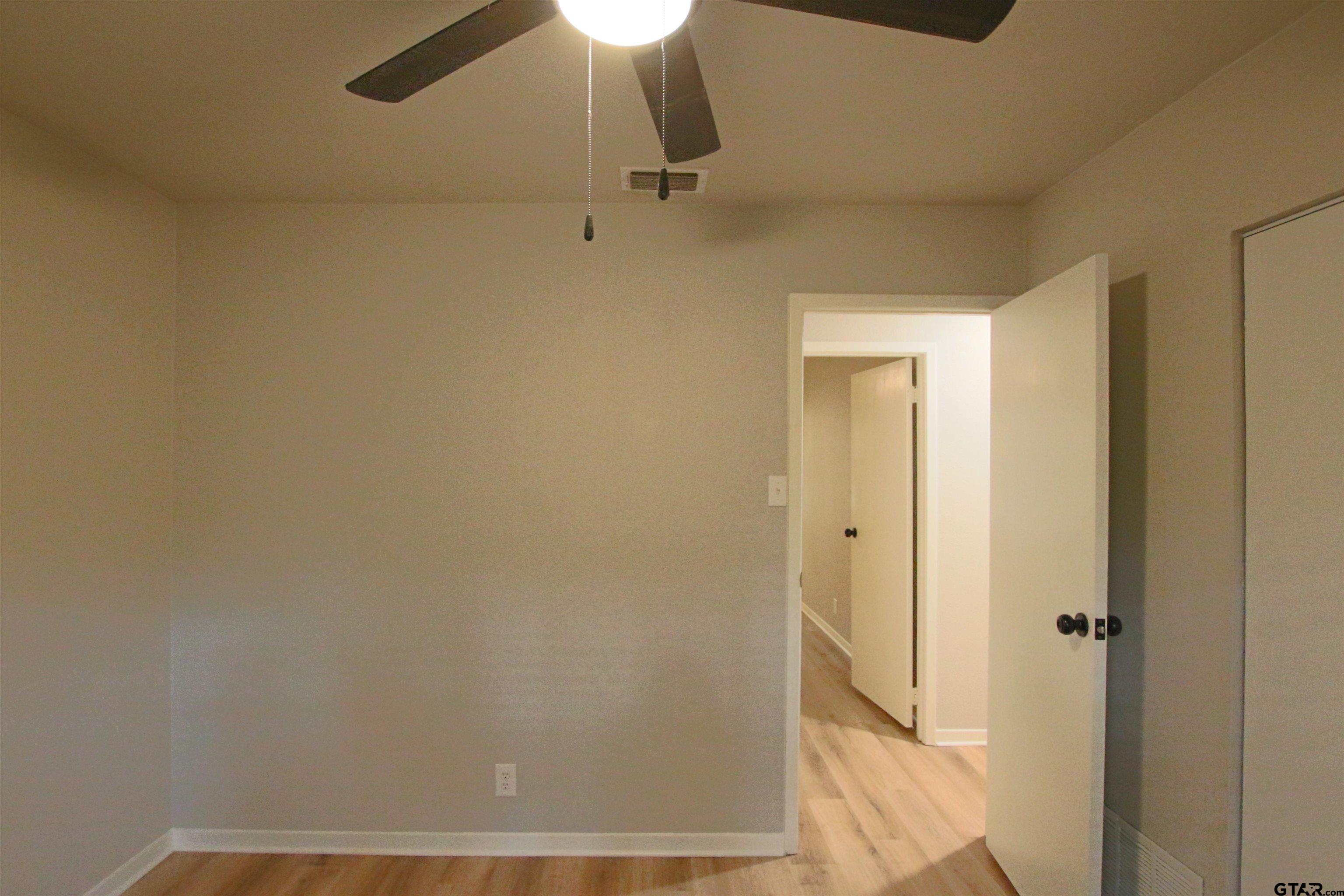 12336 Chapman Road Tyler, TX 75708 - Photo 16 of 19 a view of a room with wooden floor