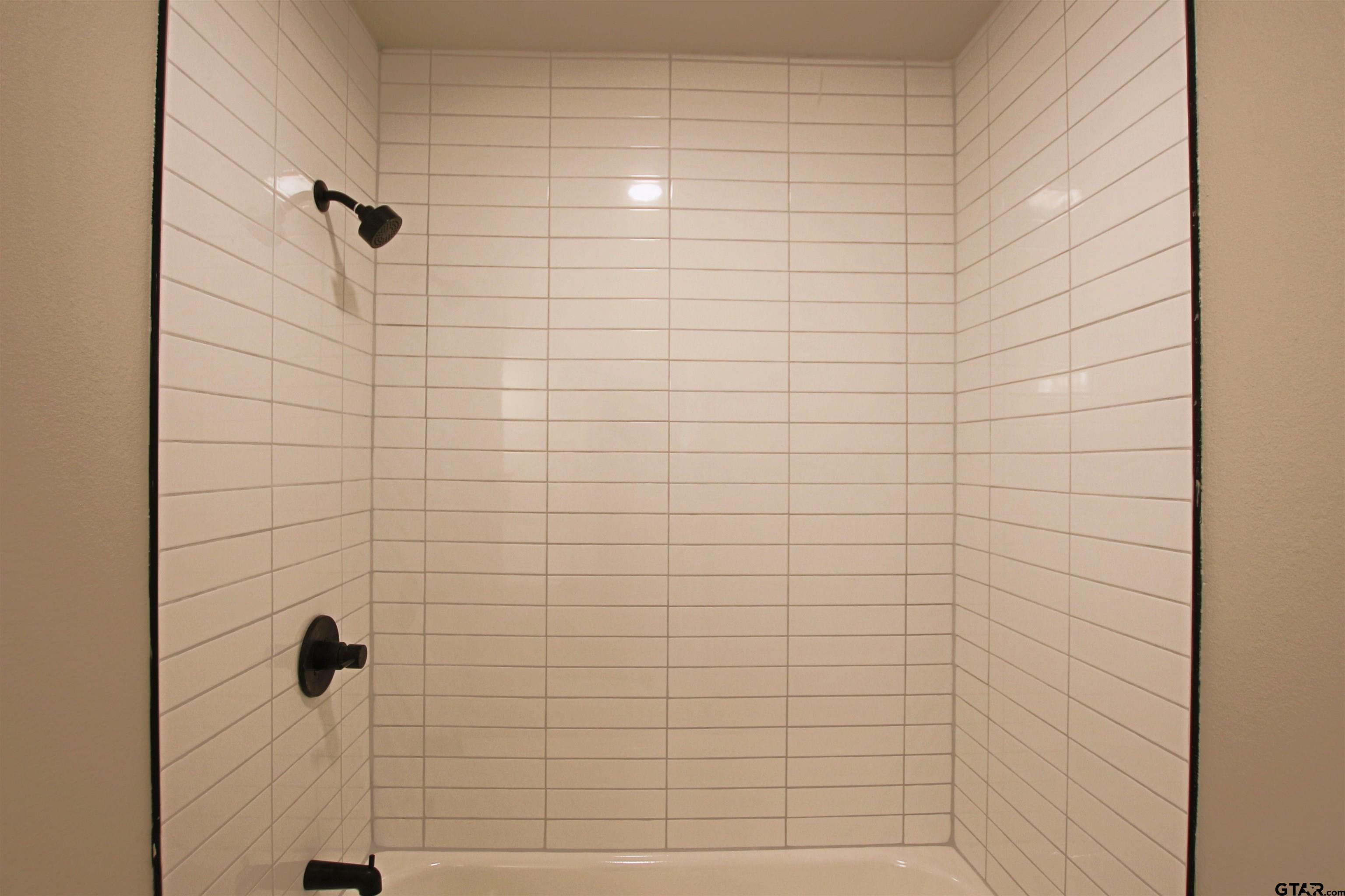 12336 Chapman Road Tyler, TX 75708 - Photo 17 of 19 a bathroom with a shower
