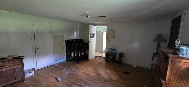 a view of a livingroom with furniture and a flat screen tv