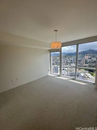 an empty room with a empty space and windows