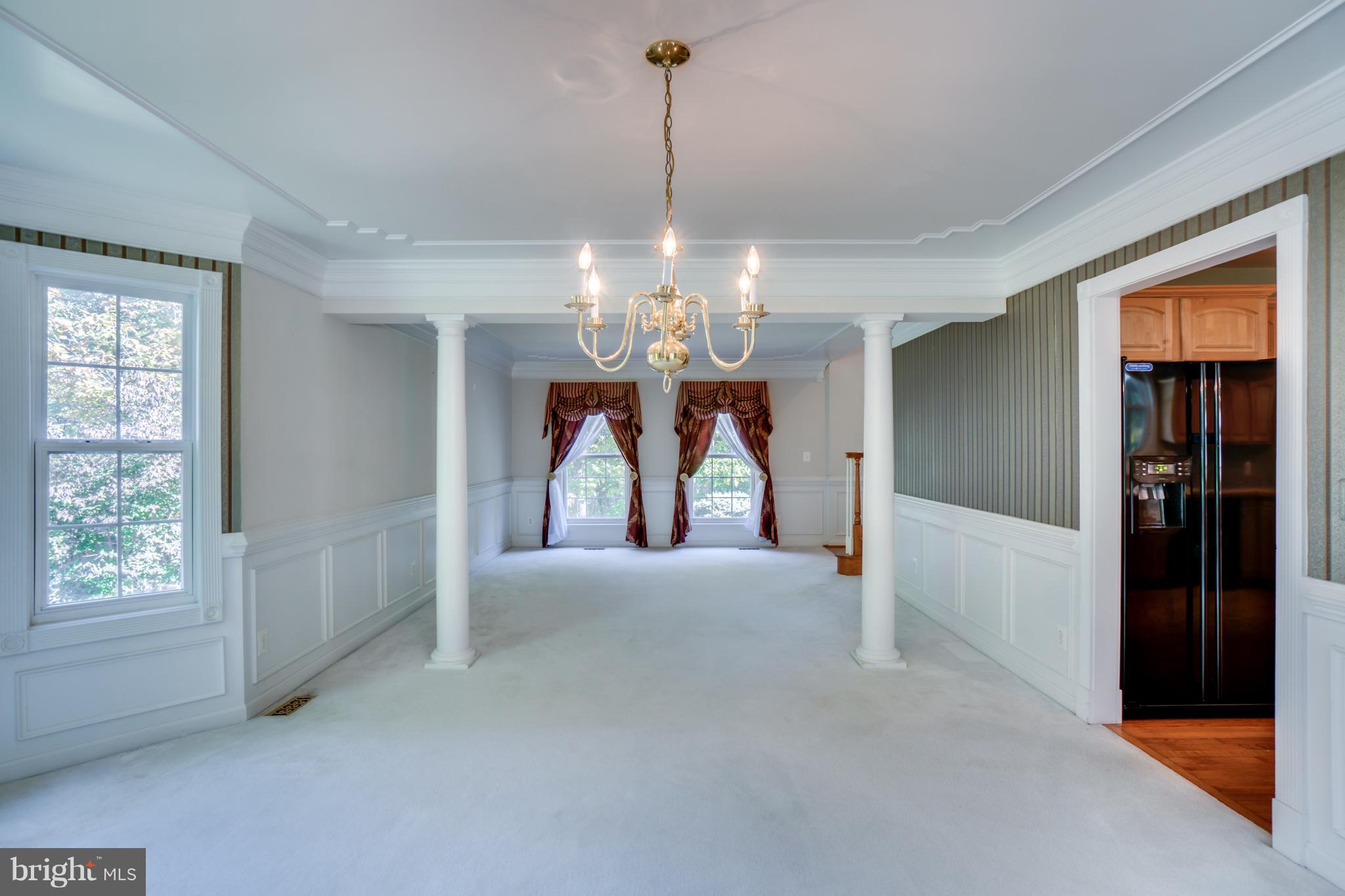 218 Greenbank Road Fredericksburg, VA 22406 - Photo 13 of 20 a view of a hallway with a chandelier and chandelier