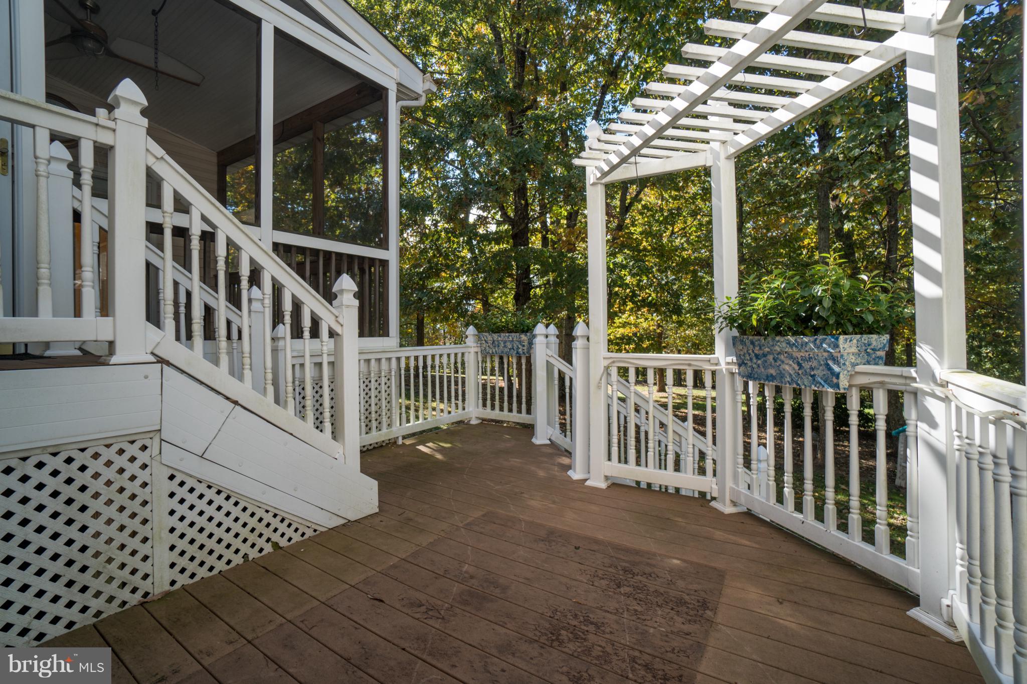 218 Greenbank Road Fredericksburg, VA 22406 - Photo 5 of 20 a view of deck with white house and wooden fence