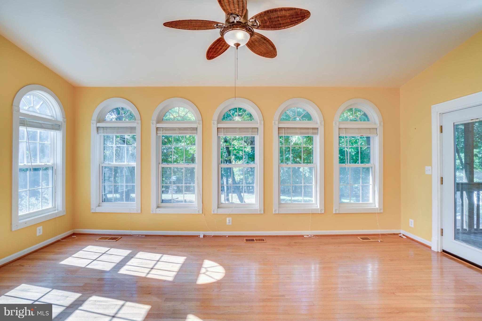 218 Greenbank Road Fredericksburg, VA 22406 - Photo 7 of 20 a view of an empty room with a window and ceiling fan