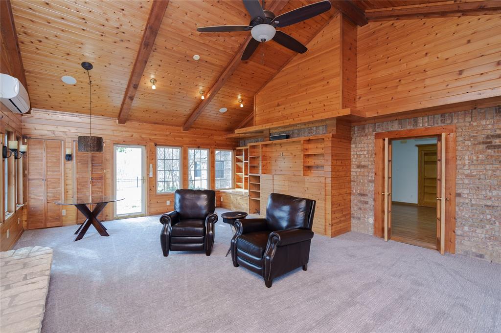 364 Parker Road, Unit A Van Alstyne, TX 75495 - Photo 17 of 39 Spacious room featuring vaulted wood-paneled ceilings with exposed beams, a ceiling fan, and recessed lighting