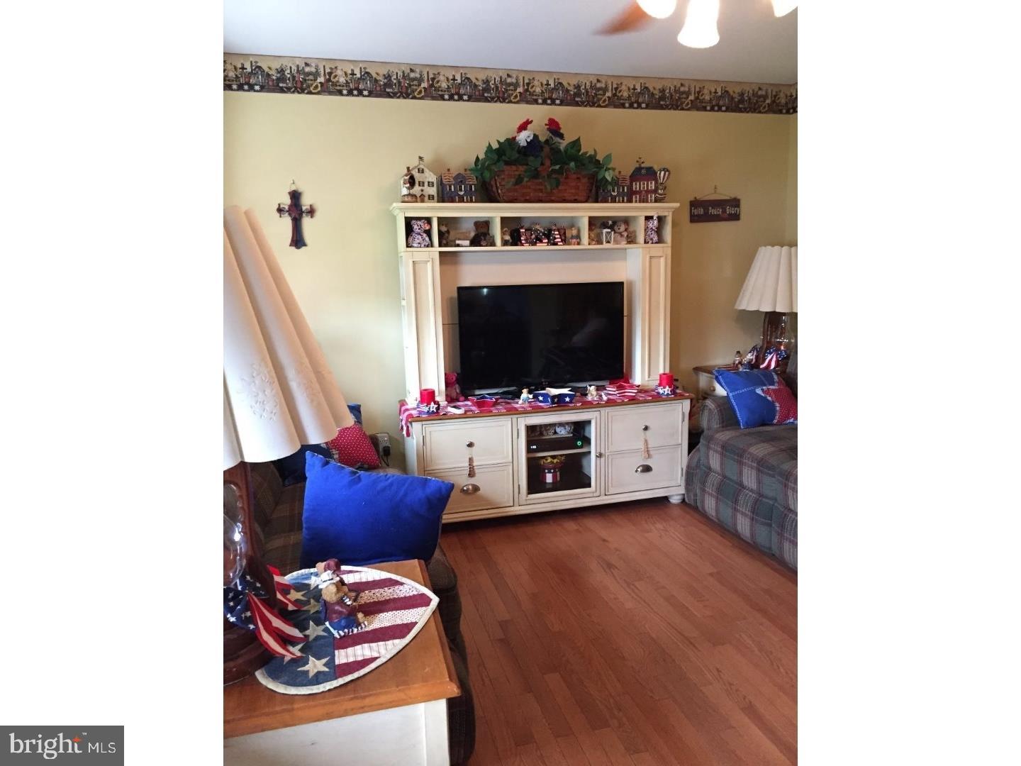 19 College Avenue Glassboro, NJ 08028 - Photo 4 of 12 a living room with furniture and a flat screen tv