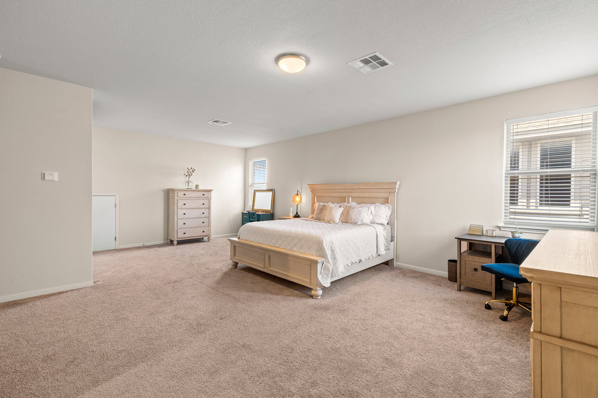 276 Finstown Street Hutto, TX 78634 - Photo 12 of 19 a bedroom with a bed and a table in it