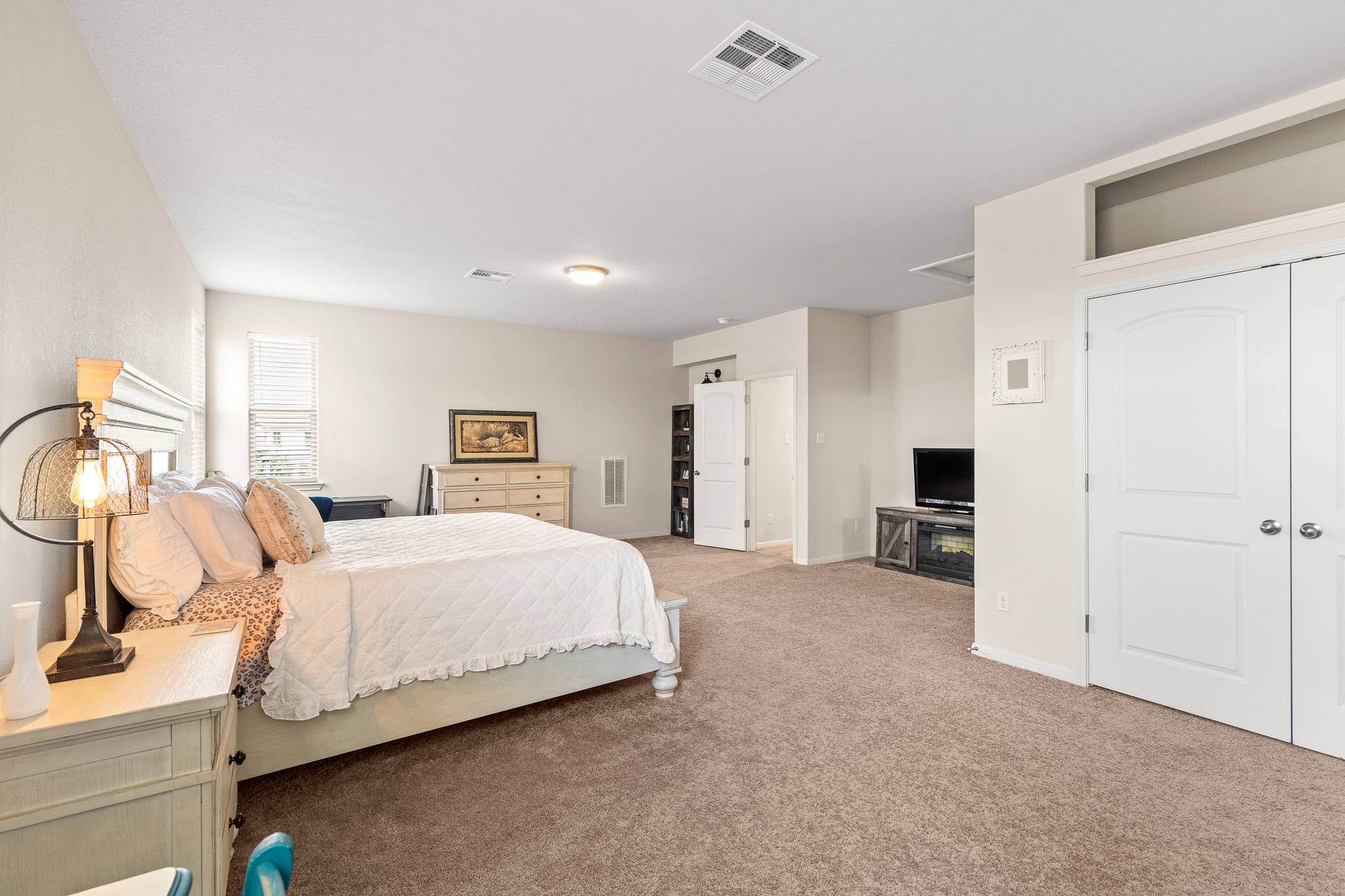 276 Finstown Street Hutto, TX 78634 - Photo 13 of 19 a bedroom with a bed and a view