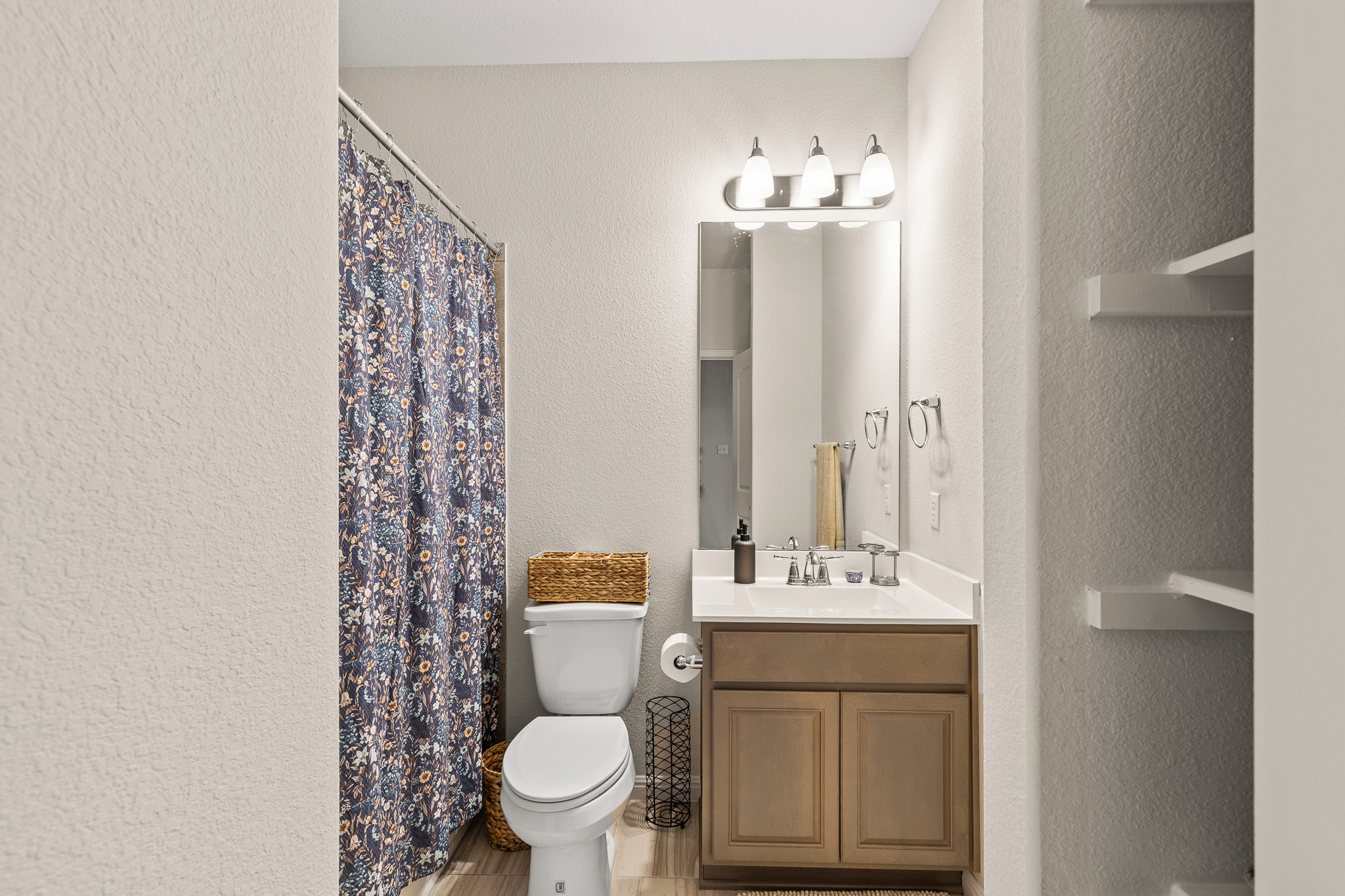 276 Finstown Street Hutto, TX 78634 - Photo 14 of 19 a bathroom with a toilet sink and mirror